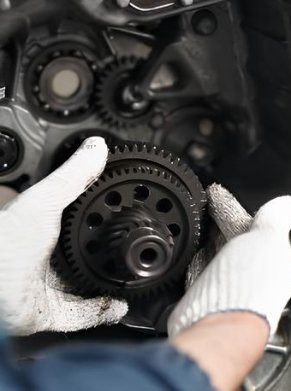 MAN FIXING A CAR ENGINE